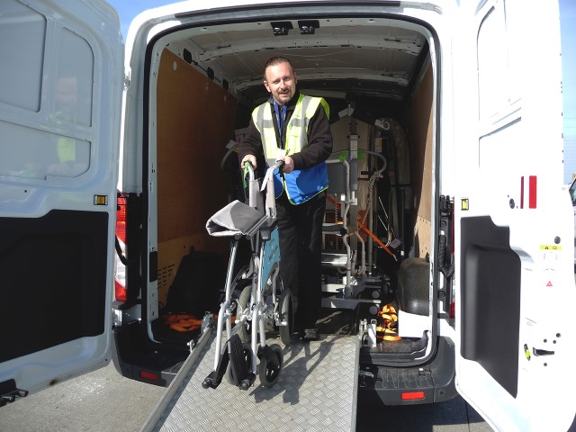 Unloading wheelchair from one of our vans at the dockside
