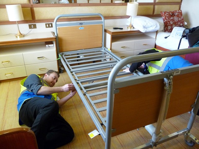 Part of our Mobility at Sea crew installing a Casabed in a cabin ready for a cruise